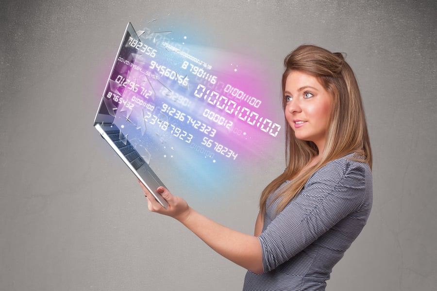 Attractive casual woman holding laptop with exploding data and numers-1